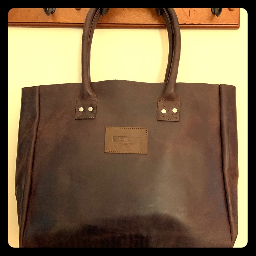 Raw leather brown tote with silver details